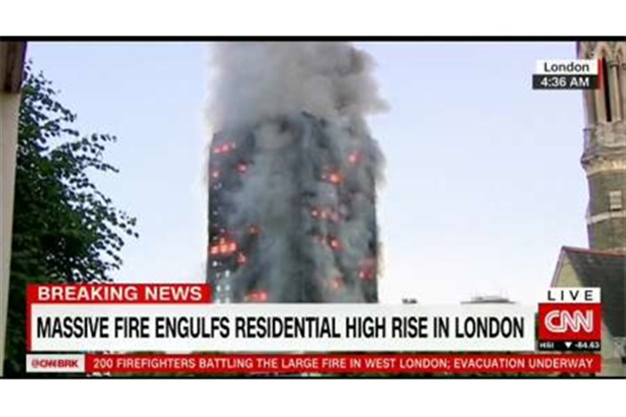 آتش سوزی گسترده یک برج مسکونی در لندن/برخی افراد خود را به بیرون پرت کردند